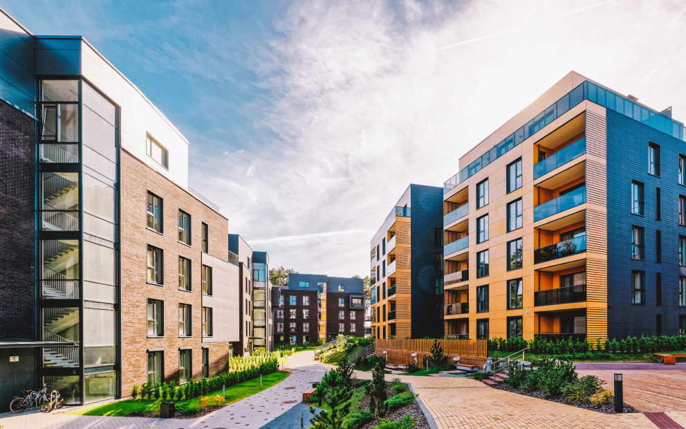 Modern residential buildings with landscaped courtyard.